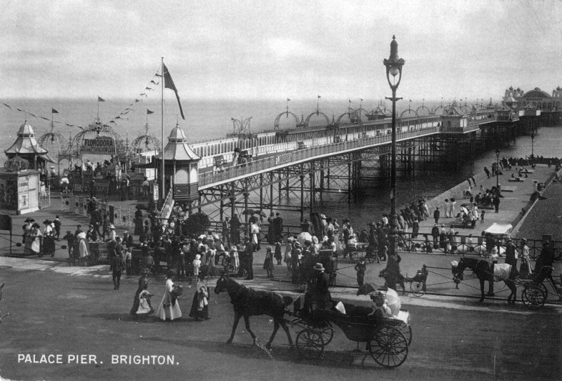 Horse and carriage the Palace Pier, Brighton by unkown
